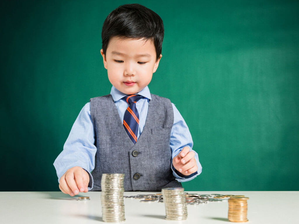 Young child counting coins