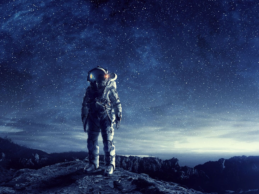 Astronaut on a mountain landscape