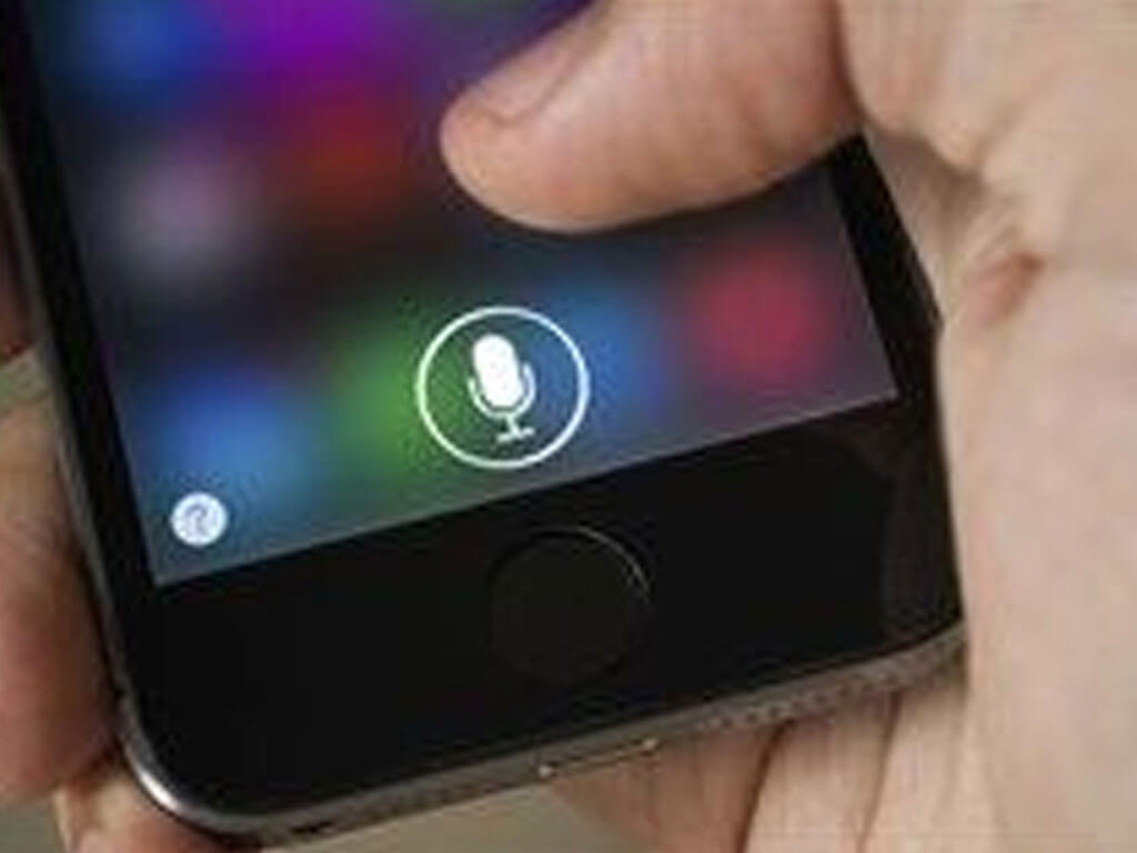Closeup of an iPhone button and the speaker icon for Siri