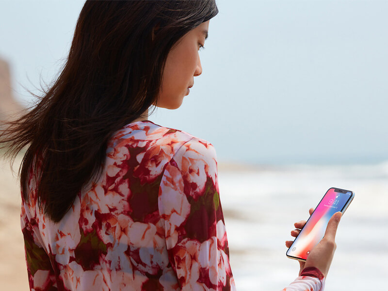 Woman holding an iPhone