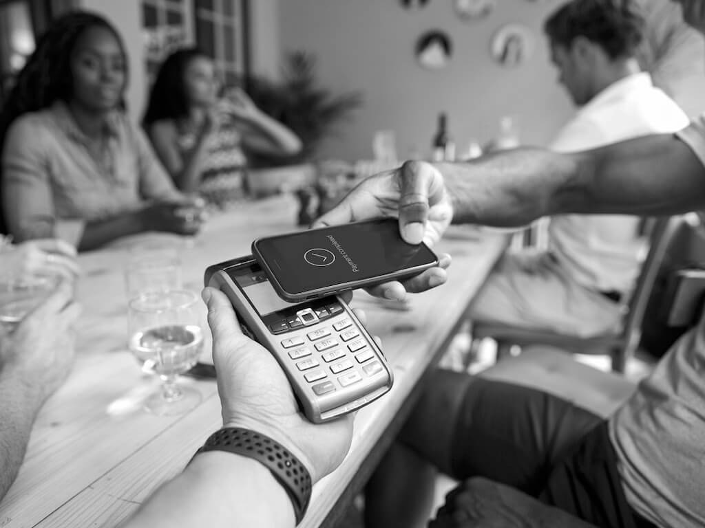 Paying a restaurant bill with a smartphone