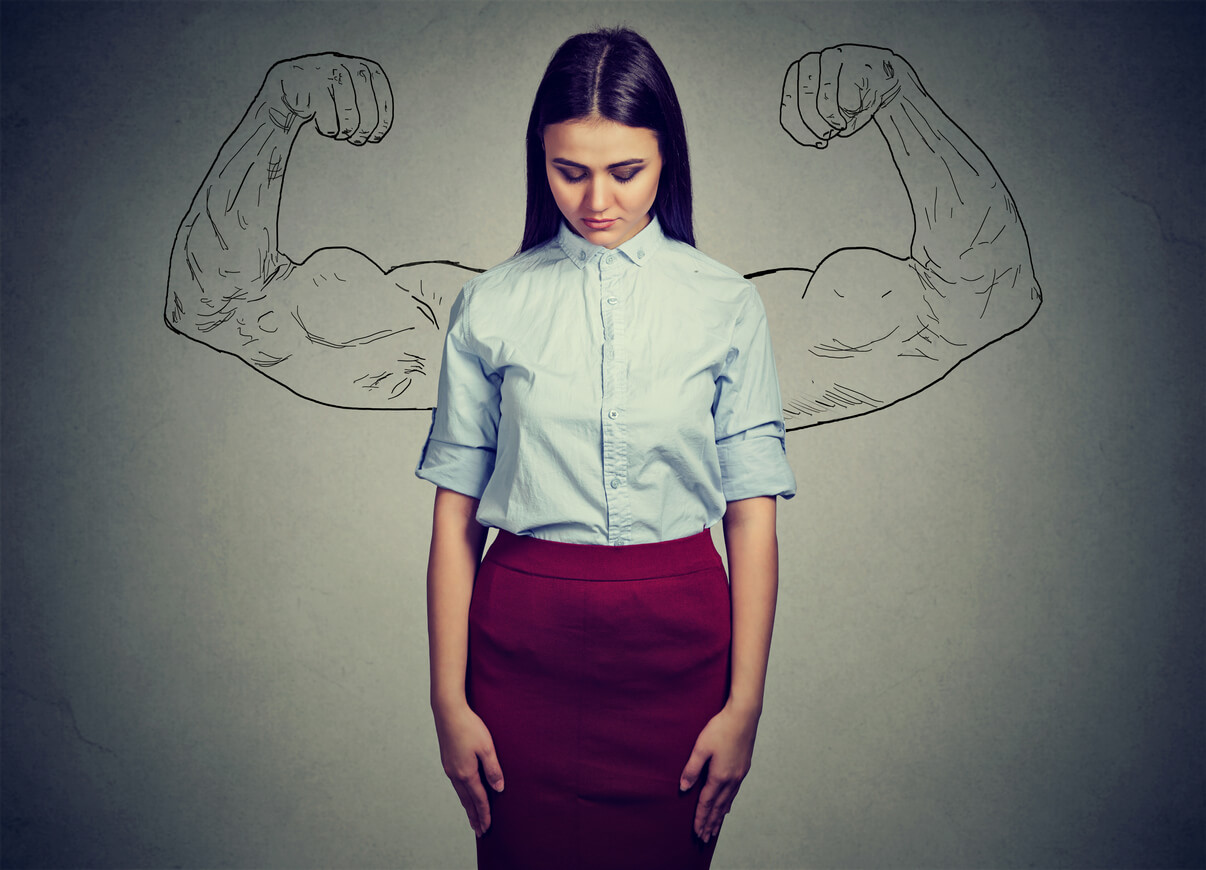 Picture of a small woman with strong arms drawing behind her