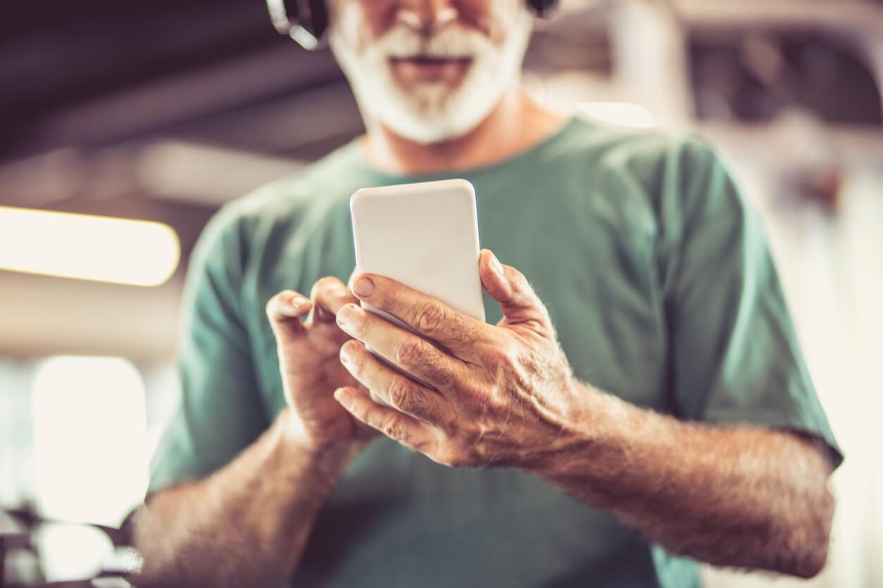 Older man looking using a smartphone